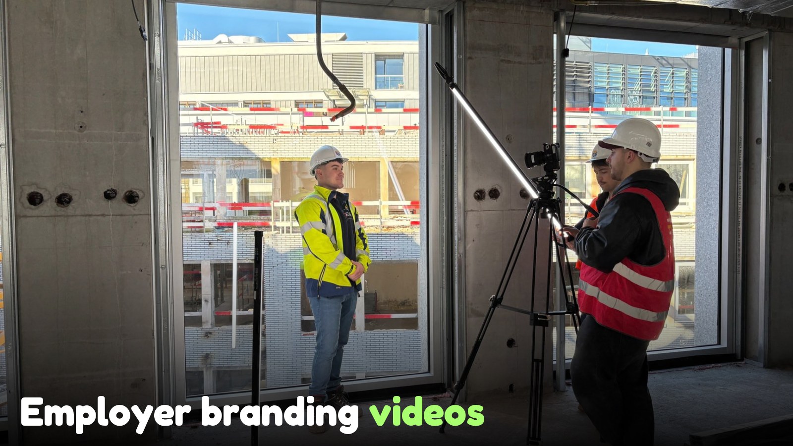 Employer branding videos: 10 Belgian examples that work | SnakLab Film crew shooting an interview at the Deloitte Job & Internship Fair, with professional lighting and a gimbal.